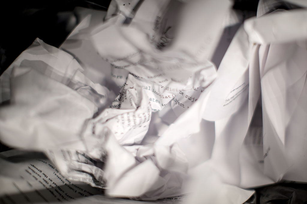 Crumpled paper lies in a waste bin after the Missouri legislature's session ends